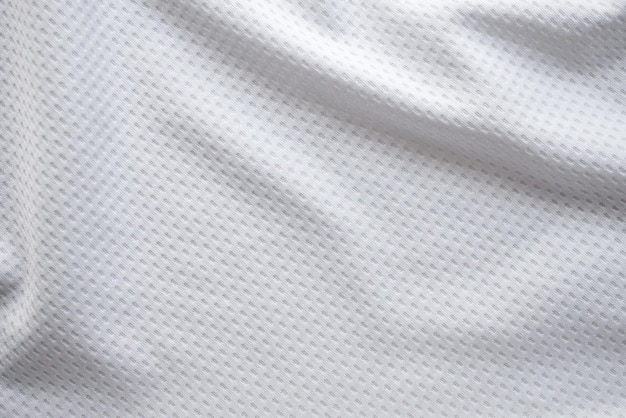 Weißes Stoff-Sportbekleidungsfußballtrikot mit Luftmaschenbeschaffenheitshintergrund