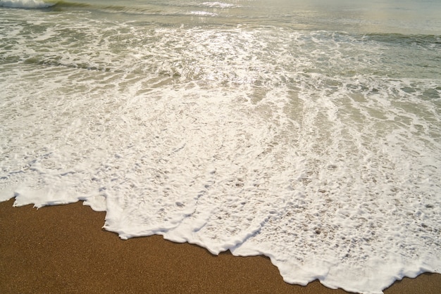 Wellen und Sand Hintergrund