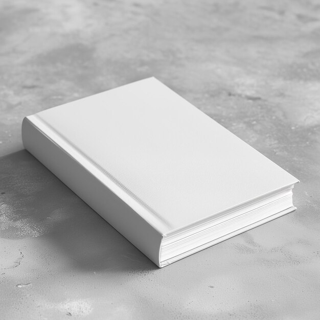 Foto a white book is laying on a concrete surface