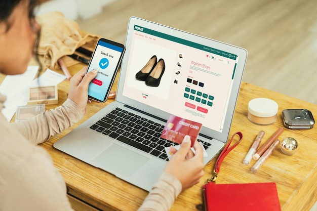 Woman shopping online on internet marketplace browsing for crucial sale items