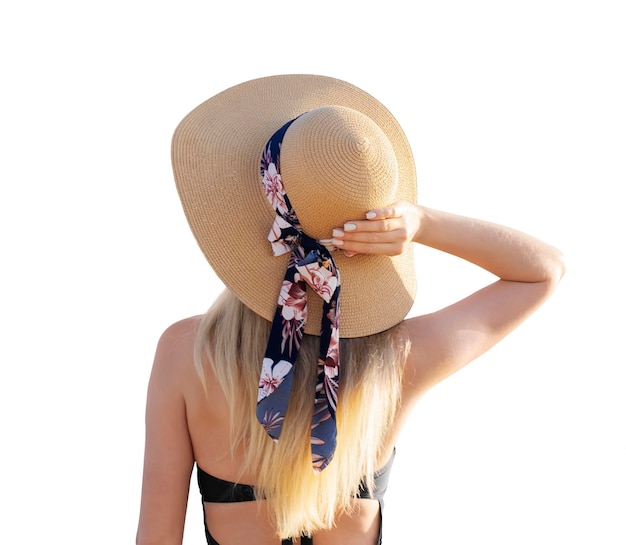 XAAnsicht eines Mädchens in einem Badeanzug und einem Hut von hinten auf einem weißen, isolierten Hintergrund