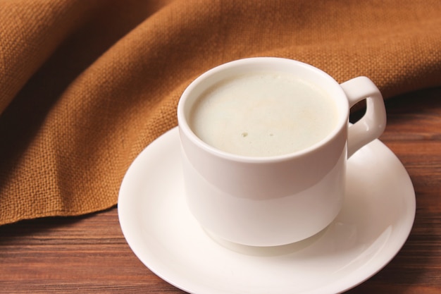 Foto xícara de café com espuma fechar com lugar para texto. foto de alta qualidade