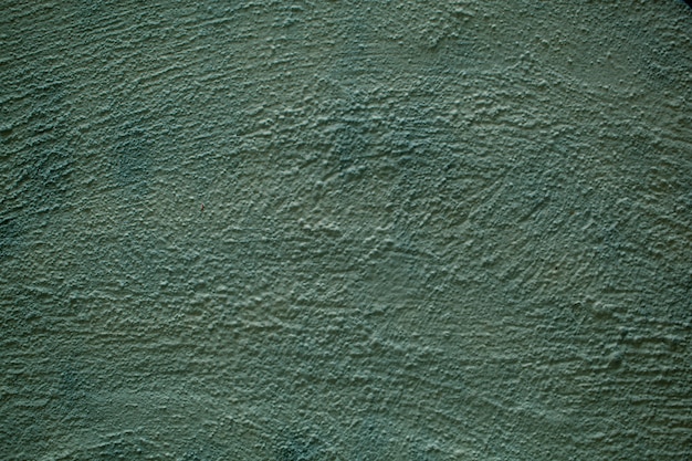 Yeso áspero pintado textura de pared verde opaco