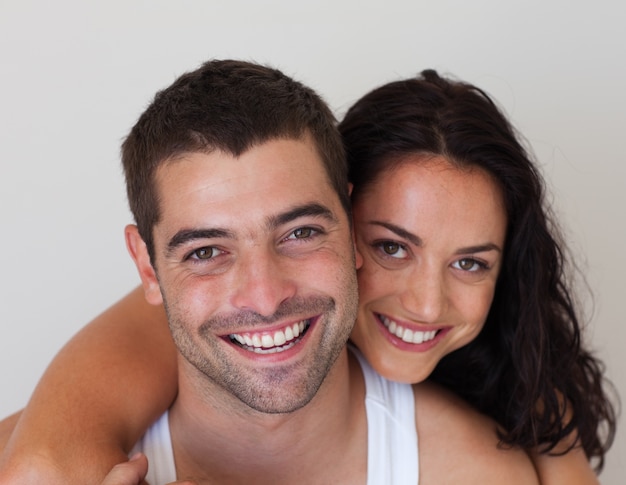 Young smiling romantic couple relaxing in each other company