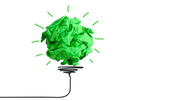Foto zerknitterter klumpen grünes papier wie eine glühbirne