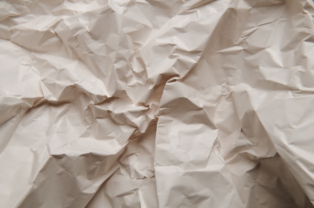 Zerknitterter Papierbeschaffenheitshintergrund