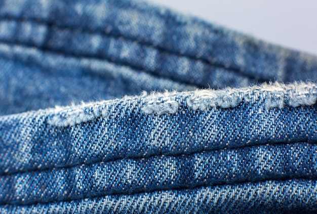 Zerrissenes blaues Hipster-Jeansmaterial