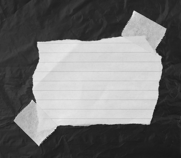 Foto zerrissenes papier mit klebeband platz für ihre nachricht