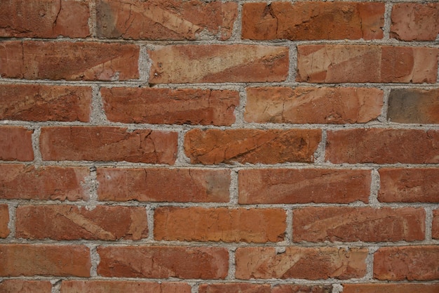 Ziegelwand aus nächster Nähe. Wand aus roten Ziegeln. Foto kann als Fotohintergrund verwendet werden