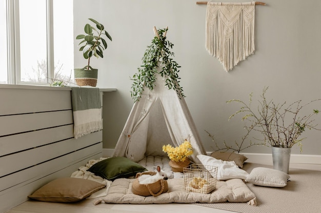 Zona de fotografia infantil de primavera com uma tenda Interior infantil Coelhos tenda de primavera ramos p