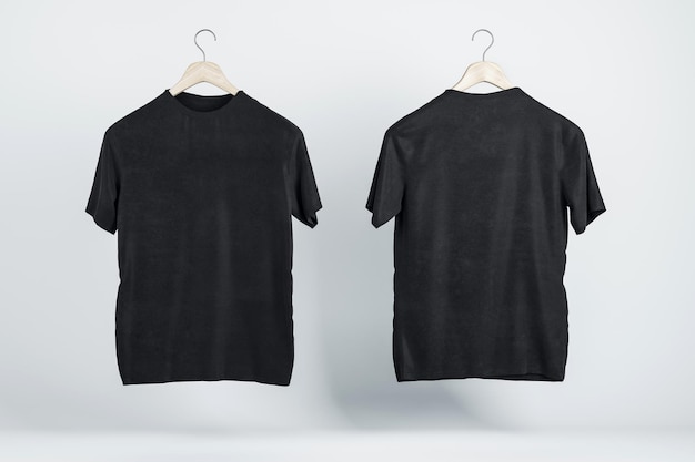 Zwei leere schwarze T-Shirts auf Holzbügeln mit Copyspace für Ihr Logo auf abstraktem hellem Hintergrund 3D-Rendering-Mockup