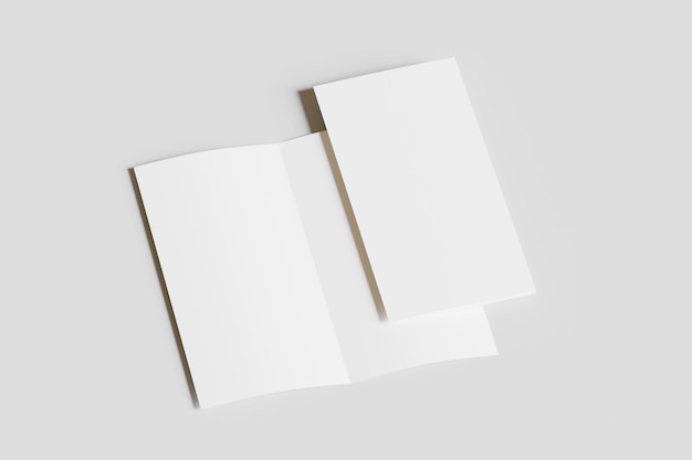 zwei quadratische Papierstücke auf einem grauen Hintergrund platziert