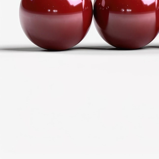 Zwei rote Kirschäpfel liegen auf einer weißen Fläche.