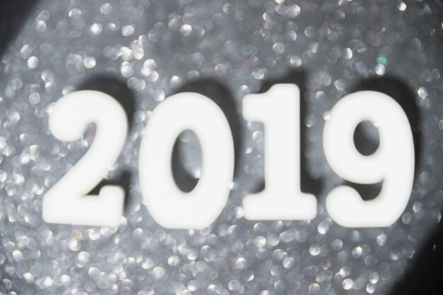 2019 inscription with bokeh on table