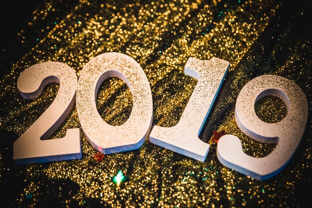 2019 inscription with gold sequins on table