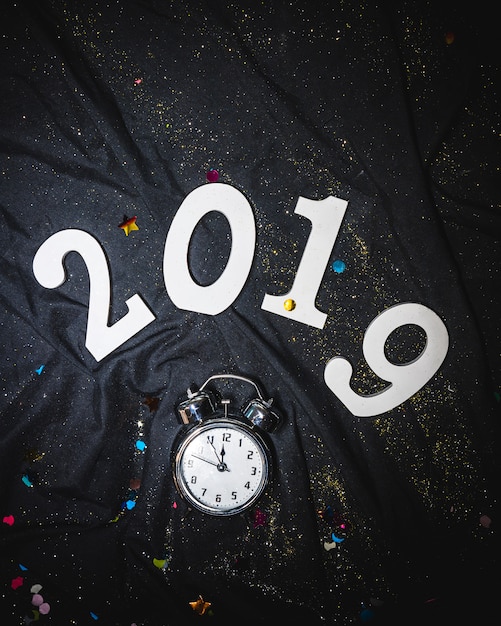 Free photo 2019 new year figures above alarm clock