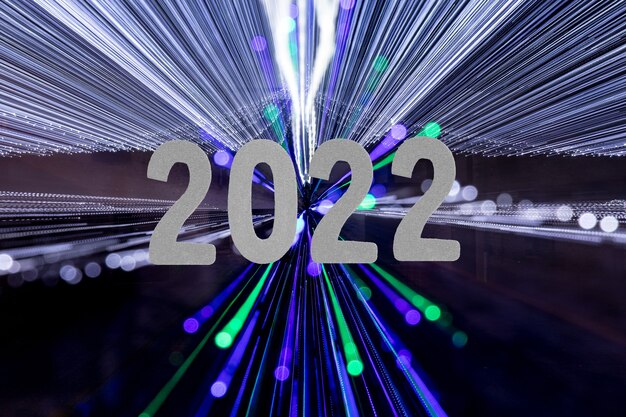 2022 new year card with lights rays background made by garlands.
