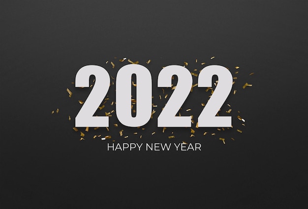 Free photo 2022 white sign over yellow confetti on a black background