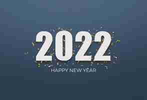 Free photo 2022 white sign over yellow confetti on a blue background