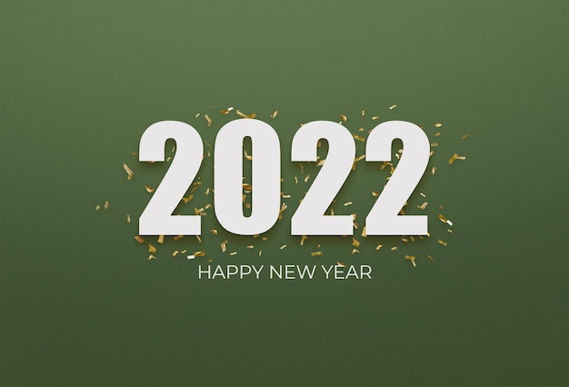 Free photo 2022 white sign over yellow confetti on a green background