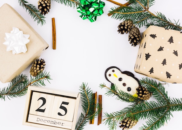 25 December inscription on wooden blocks with green branches