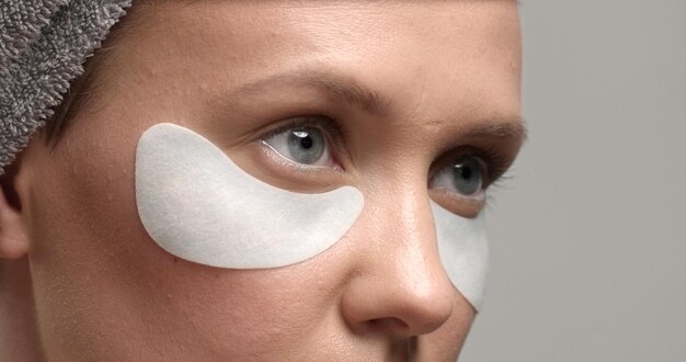 30's woman with an eye patches on closeup