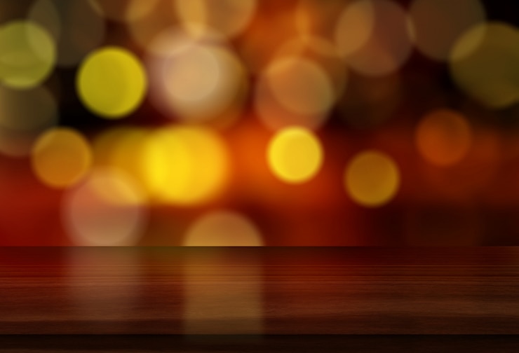 Free Photo 3d christmas background with wooden table against bokeh lights design