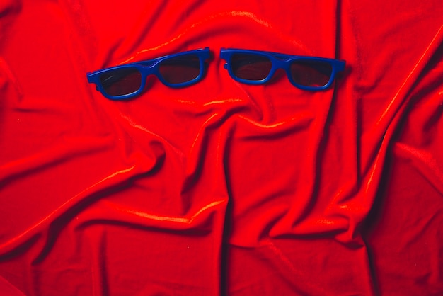 Free photo 3d glasses on velvet cloth