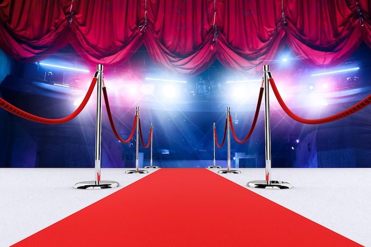  3d rendering realistic red carpet and pedestal with illumination and barrier fences with velvet rop