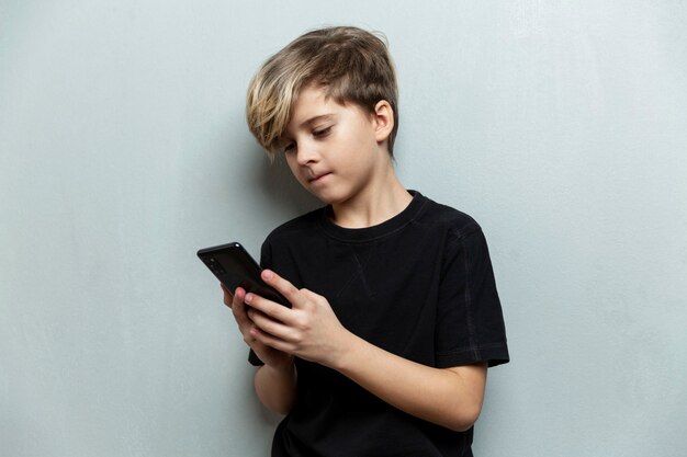 Premium Photo Education Addiction To Telephone Technology Internet Social Nets Pre Teens Concept Premium Photo Education Addiction To Telephone Technology Internet Social Nets Pre Teens Concept