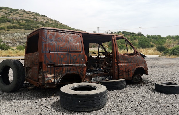 Free photo abandoned burnt out car