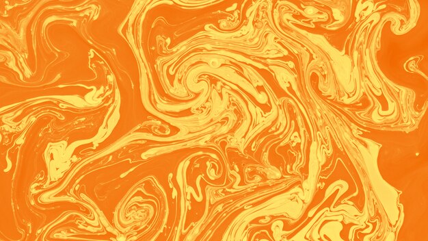 An abstract acrylic yellow and orange paint backdrop