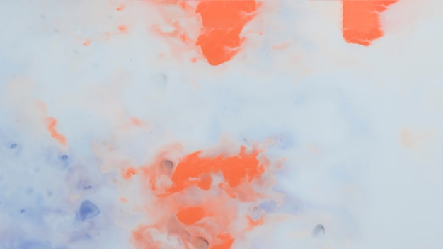 抽象的な芸術的なオレンジと青のペンキの背景