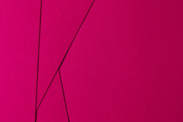 テクスチャ板紙とピンクの幾何学的構成の抽象的な背景