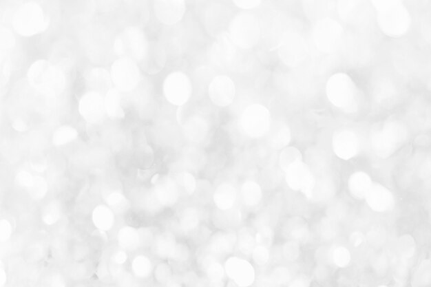 Abstract background with white bokeh lights