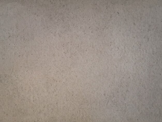 Abstract beige grunge cement wall texture.