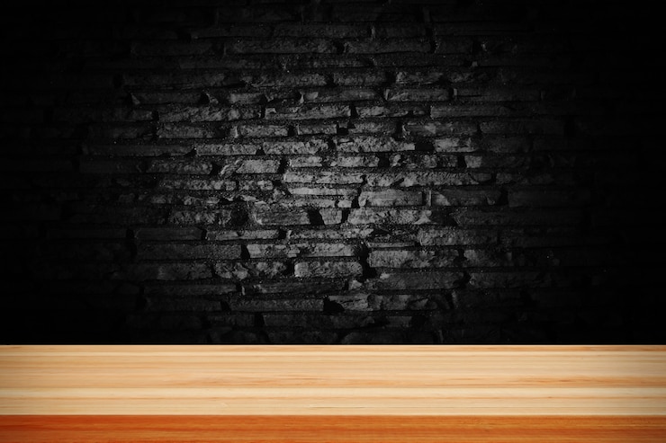 Free Photo abstract black grunge brick and wooden table deck.