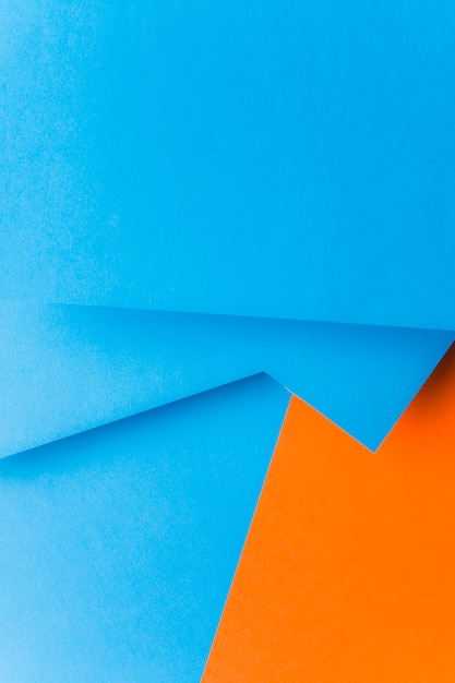 グリーティングカードの抽象的な青とオレンジ色の紙の背景