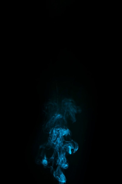 Abstract blue smoke on black background