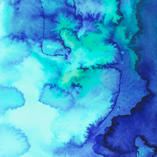 Abstract blue and turquoise watercolor blot painted background