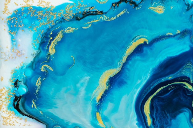 ゴールド​の​キラキラ​背景​と​抽象的​な​青い​水彩画