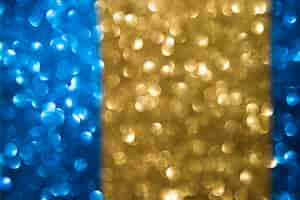 Free photo abstract blurred blue and golden bokeh background