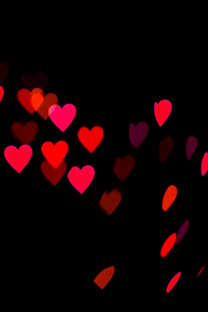 Abstract bokeh background with heart shaped lights