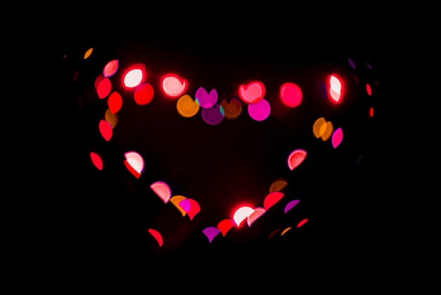 Free photo abstract bokeh background with heart shaped lights