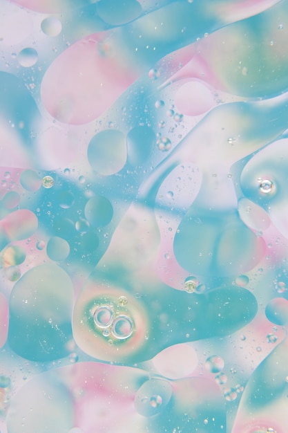 Abstract bubbles over the blue and pink backdrop texture