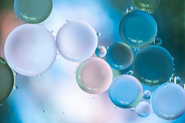 Abstract bubbles on multicolored blurred background