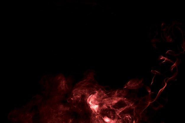 The abstract burning bright smoke on a black background