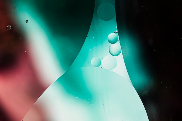 Foto gratuita astratto sfondo colorato in olio e onde sulla superficie dell'acqua