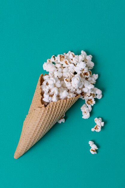 Abstract concept of ice cream cone and salted popcorn