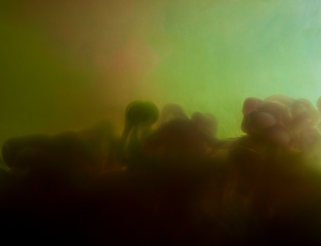 Free photo abstract dense cloud between green smoke